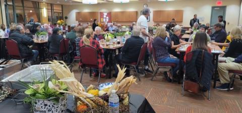 Members socializing over apps and desserts